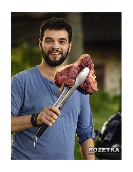 Pinza Weber in acciaio inox che sorregge una fiorentina